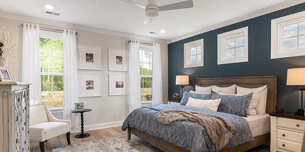 Bedroom at EnclaveSouthPointe by DRB Coastal