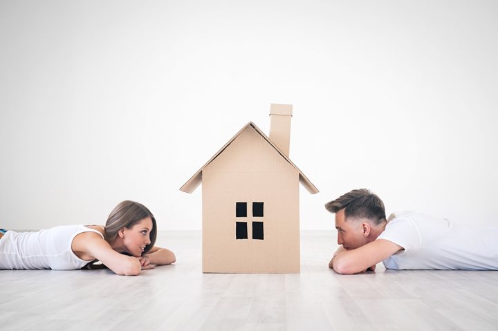 Homebuyers looking at house