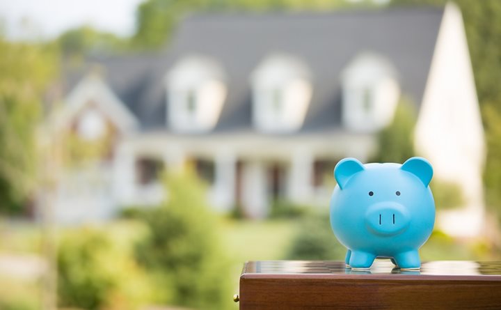 Piggy Bank in front of Home