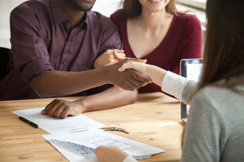 Homebuyer handshake with realtor