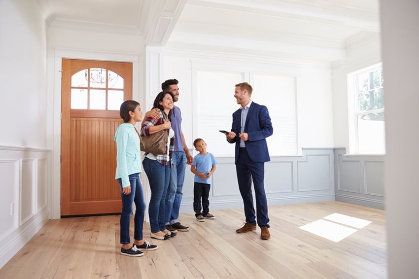 Realtor Showing New Home to Family of Four